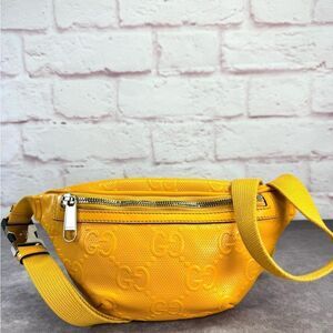 Gucci Embossed Gg Leather Perforated Belt Fanny Sling Bag Yellow